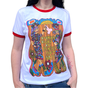 A statement art T shirt by Antayjo Art with a colourful funny fashion illustration with the words Drawing dicks on fences isn’t art